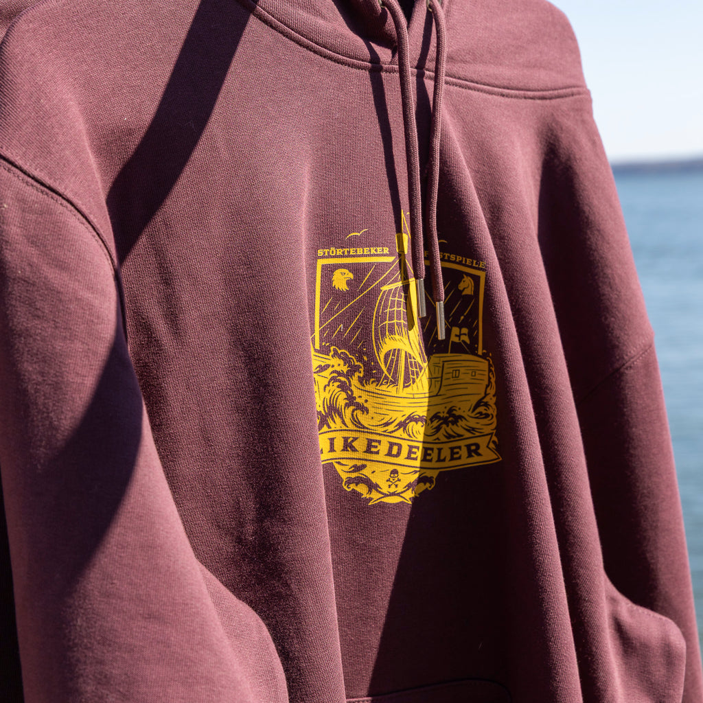 Störtebeker Unisex Hoodie „Plakat 2026" in rotbraun